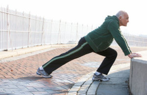 an elderly man stretching