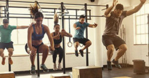 people jumping in a group exercise class