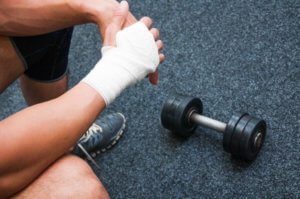 a person with an injured hand at gym