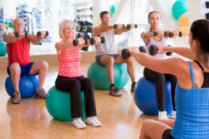 instructor taking an exercise class at gym