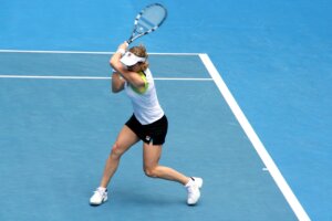 female tennis player hitting a back hand