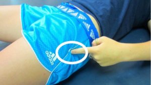 Image: person laying down point to the side of their hip