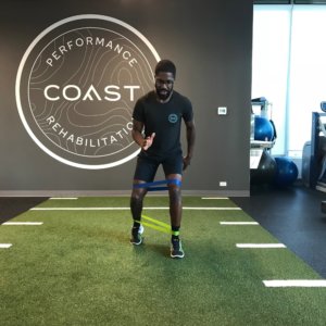 image: person walking with exercise bands around their knees and ankles