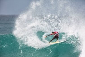 surfer performing a roundhouse cut back